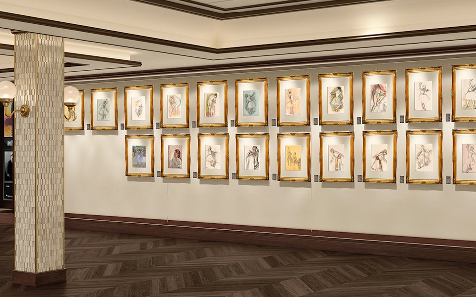 An onboard art gallery with framed drawings displayed on a wall | MSC Cruises An onboard art gallery with framed drawings displayed on a wall | MSC Cruises