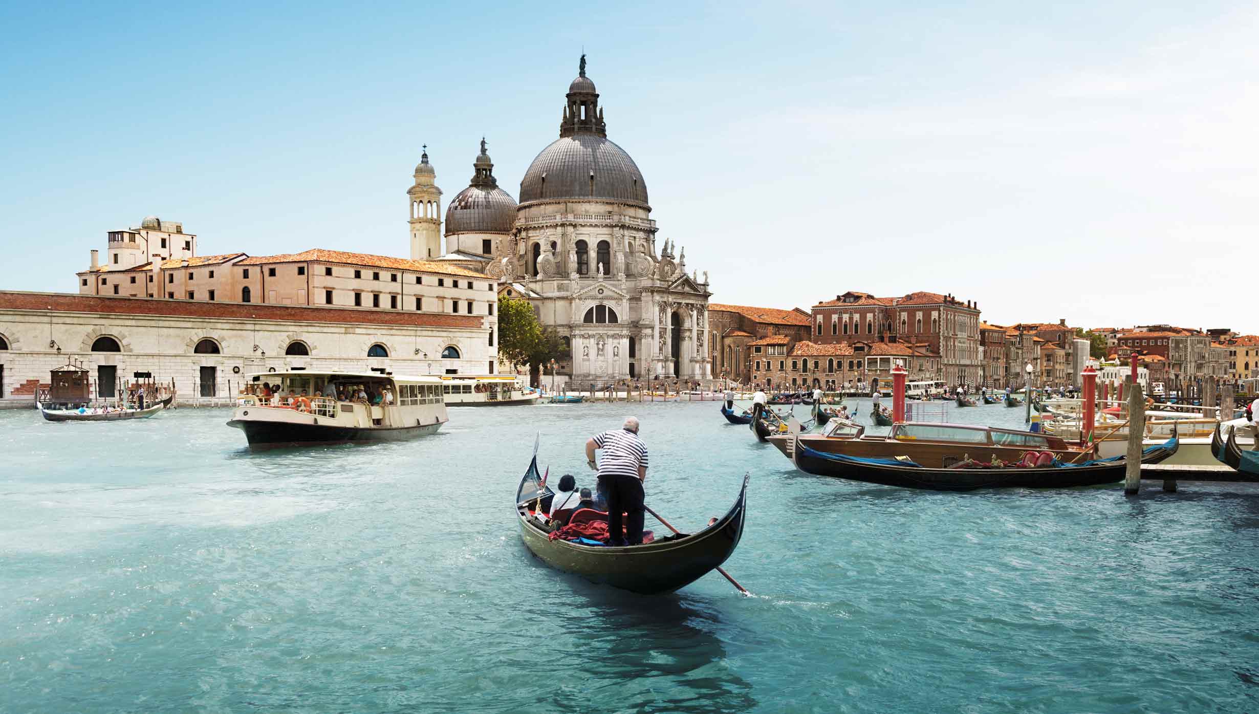 A gondola on Venice's Grand Canal with Santa Maria della Salute in the background | MSC Cruises A gondola on Venice's Grand Canal with Santa Maria della Salute in the background | MSC Cruises