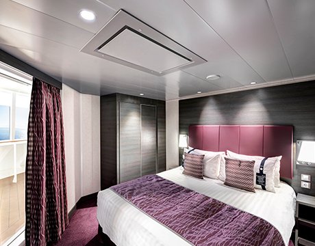 Luxurious cruise cabin with purple accents and balcony view | MSC Cruises Luxurious cruise cabin with purple accents and balcony view | MSC Cruises